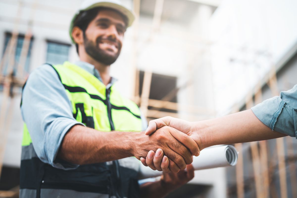 rendering contractor shaking hands with client